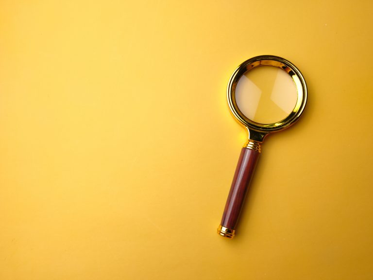 Vintage Brass Color Pocket Magnifying Glass/Magnifier Gift/60mm Portable on a yellow background.